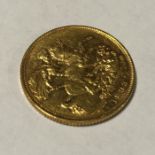 An 1898 gold sovereign. Est. £250 - £350.