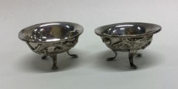 A pair of Chinese silver salts with dragon decorat