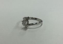 An Art Deco single stone diamond ring in claw moun