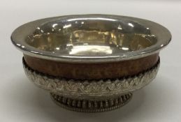 An unusual wooden and silver mounted mazer decorat