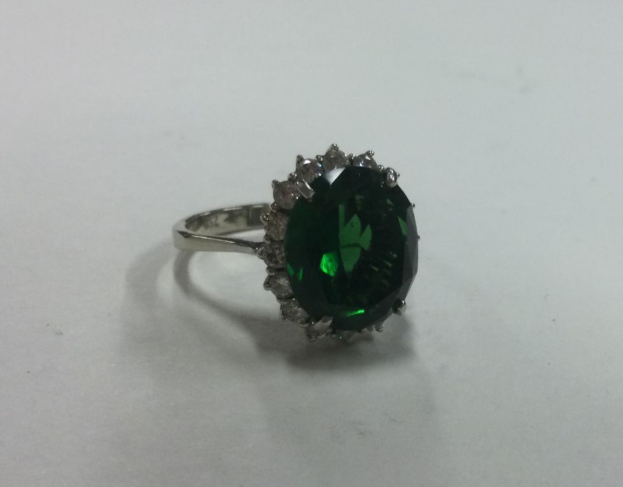 An attractive oval green stone and diamond cluster - Image 3 of 3