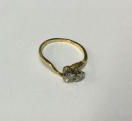 A diamond two stone crossover ring in 18 carat gol