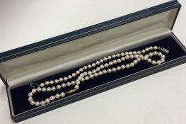 A gold mounted pearl necklace together with a brac