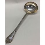 A heavy Grecian pattern silver soup ladle. London