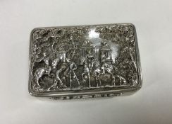 A finely cast Victorian silver snuff box decorated