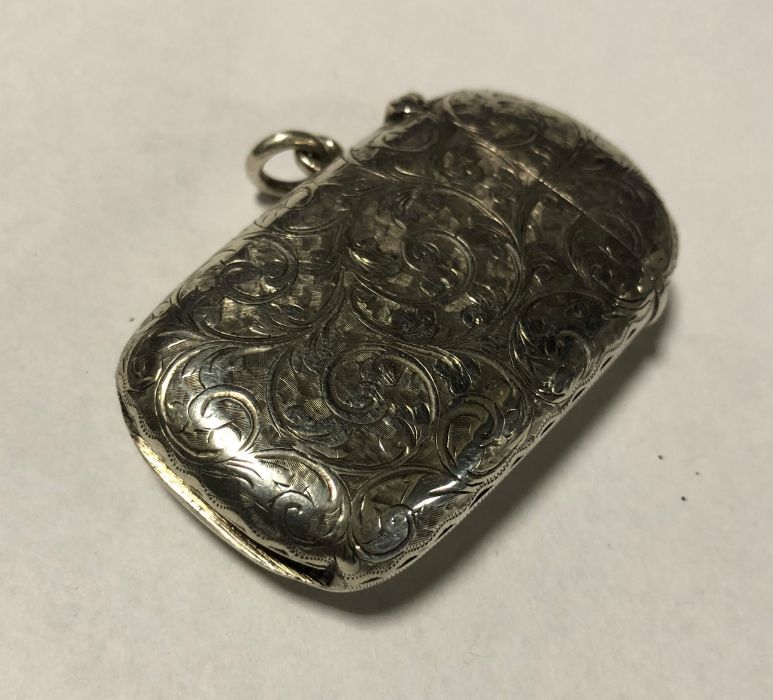 A silver engraved vesta case. Birmingham. Approx.