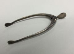 A heavy pair of silver wishbone sugar tongs of typ