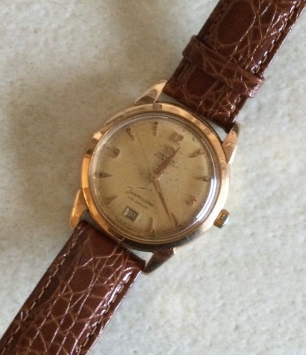 OMEGA: An 18 carat Seamaster calendar wristwatch with