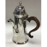 A rare George I silver hinged top chocolate pot wi