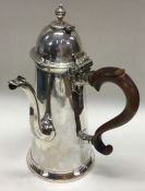 A rare George I silver hinged top chocolate pot wi