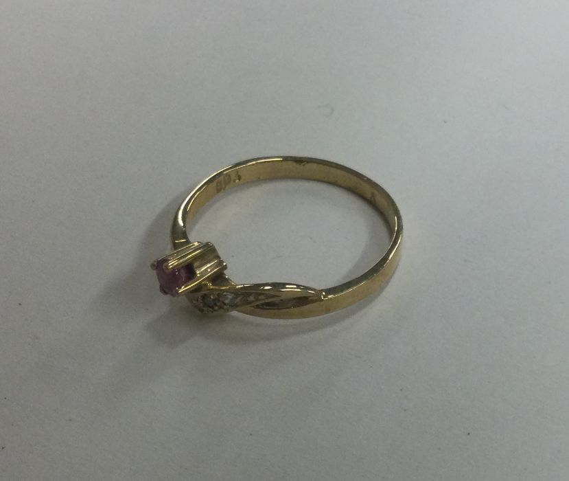 A ruby and diamond four stone crossover ring. Appr - Image 2 of 2