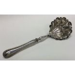 A Continental silver sifter ladle with bead edge.