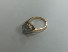 An 18 carat single stone ring in claw mount. Appro