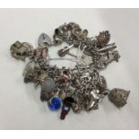 A heavy silver curb link charm bracelet. Approx. 5