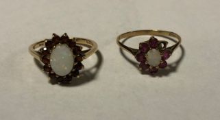 Two 9 carat opal rings. Approx. 4 grams. Est. £30 -