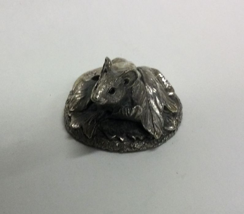 A novelty silver paperweight in the form of a mous