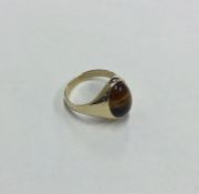 A 9 carat mounted tiger's eye gypsy set ring. Appr