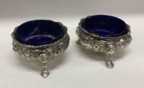 A pair of heavy Victorian silver salts with chased