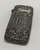 A large castle top silver cigar case decorated wit