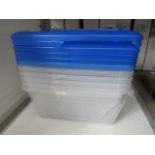 Stack of approx. 5x clear plastic storage boxes with blue lids, some damaged