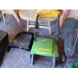 Green electric lawn rake with grass catcher