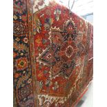 (35) Multi-coloured floral carpet with red border