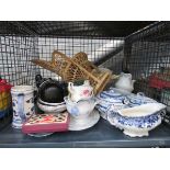 Cage containing blue and white tureens and other crockery, a Home Pride figure and a mini peacock