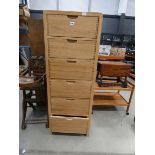A narrow ercol chest of 6 drawers