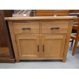 An oak sideboard, 2 doors over 2 drawers