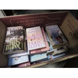 A box containing a quantity of novels