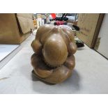 5040 - Carved wooden figure of a distressed man