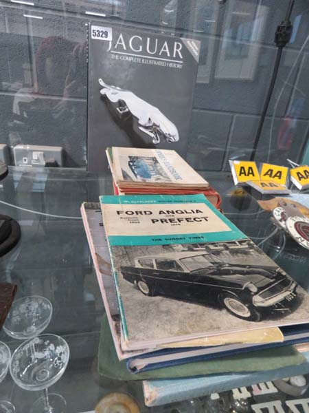 Jaguar Complete History plus a quantity of Ford and other owner's handbooks