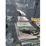 Jaguar Complete History plus a quantity of Ford and other owner's handbooks