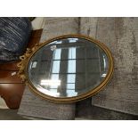 5213 - Oval bevelled mirror in gilt frame