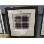 A framed and glazed Aberlour distillery tartan