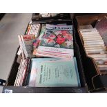 A box containing a War Picture Library magazines, plus Womans Journals