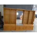 Contemporary oak breakfront open-fronted bookcase with a glazed and illuminated central section