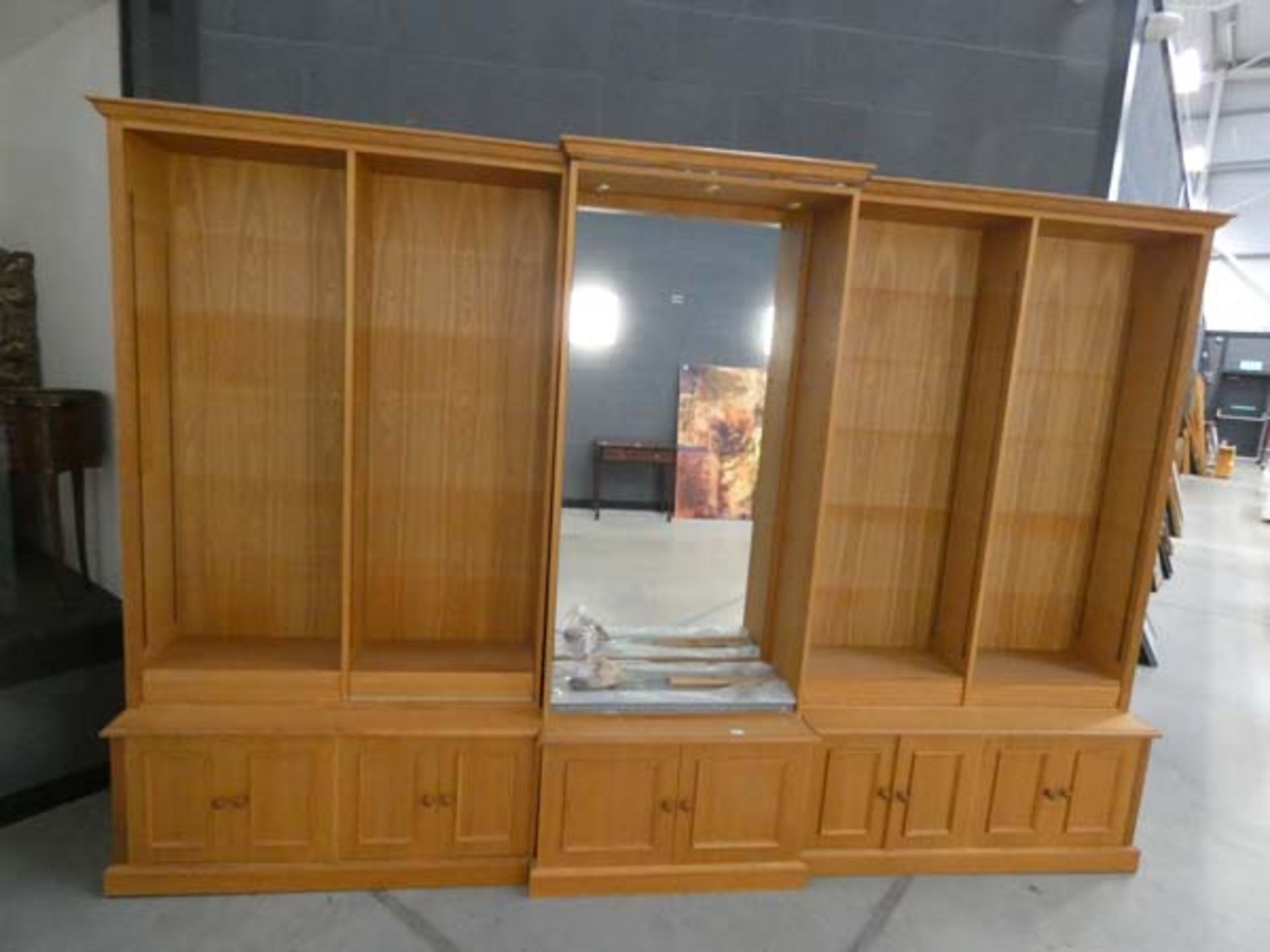 Contemporary oak breakfront open-fronted bookcase with a glazed and illuminated central section