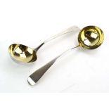 A pair of George III silver and parcel gilt old English pattern sauce ladles, Richard Croppley,