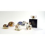 Five Royal Crown Derby paperweights, in the form of a fox, a hedgehog, two pigs and a beetle,