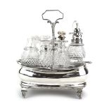 A George III silver seven bottle cruet stand of typical boat shaped form on four classical feet,