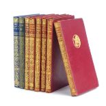Rudyard Kipling: a collection of eight early 20th century editions in red and blue bindings,