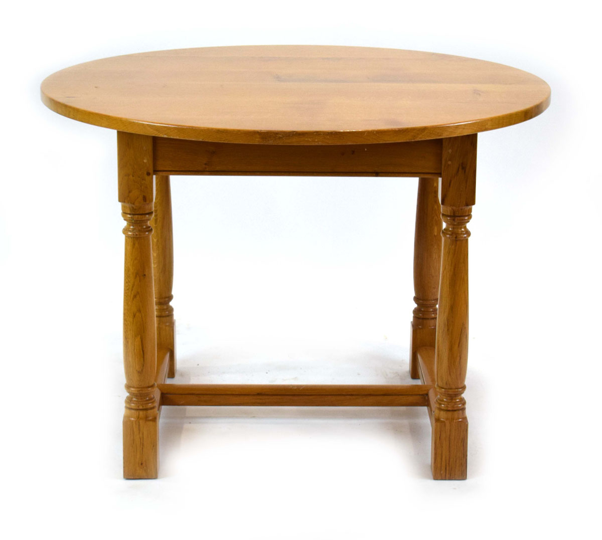 A late 20th century golden oak centre table, the circular surface on four turned supports, - Image 2 of 7
