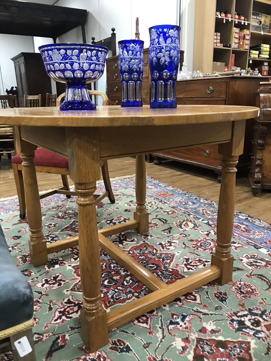 A late 20th century golden oak centre table, the circular surface on four turned supports, - Image 5 of 7