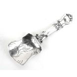 A Victorian silver caddy spoon of shovel form with Rococo handle, George Unite, Birmingham 1868, l.