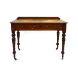 An early 20th century mahogany writing table with tooled leather surface above a pair of frieze