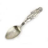An American metalware and parcel gilt caddy spoon,