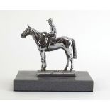 A car mascot modelled as a jockey and horse,