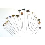 Twenty silver and metalware hat pins including hardstone and glass set examples, max l. 29.