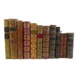 A collection of 40+ Antiquarian leather bindings featuring a variety of style and format.
